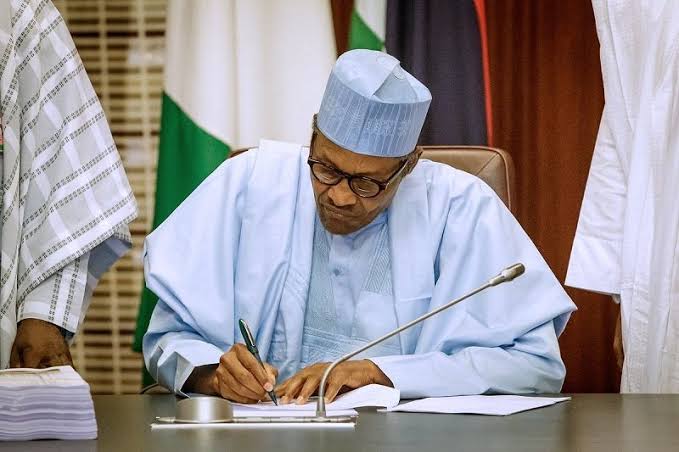 President, Major General Muhammadu Buhari (retd.) Signing a document